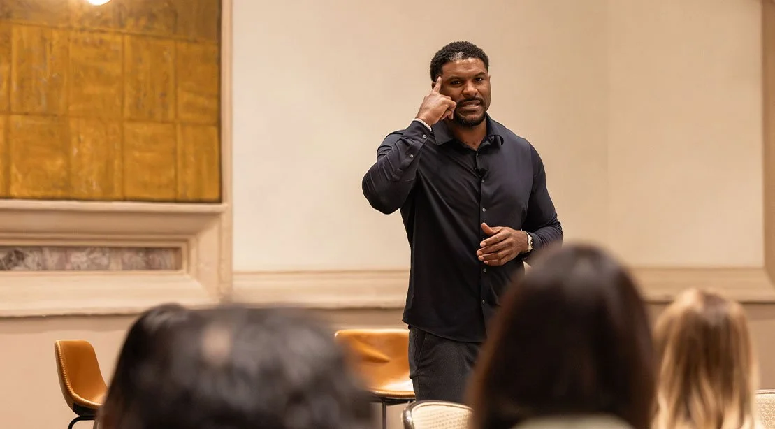 Julius Thomas at a speaking event teaching about mental strength